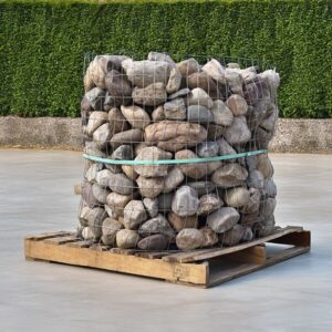 Gabion of river rocks on wooden pallet